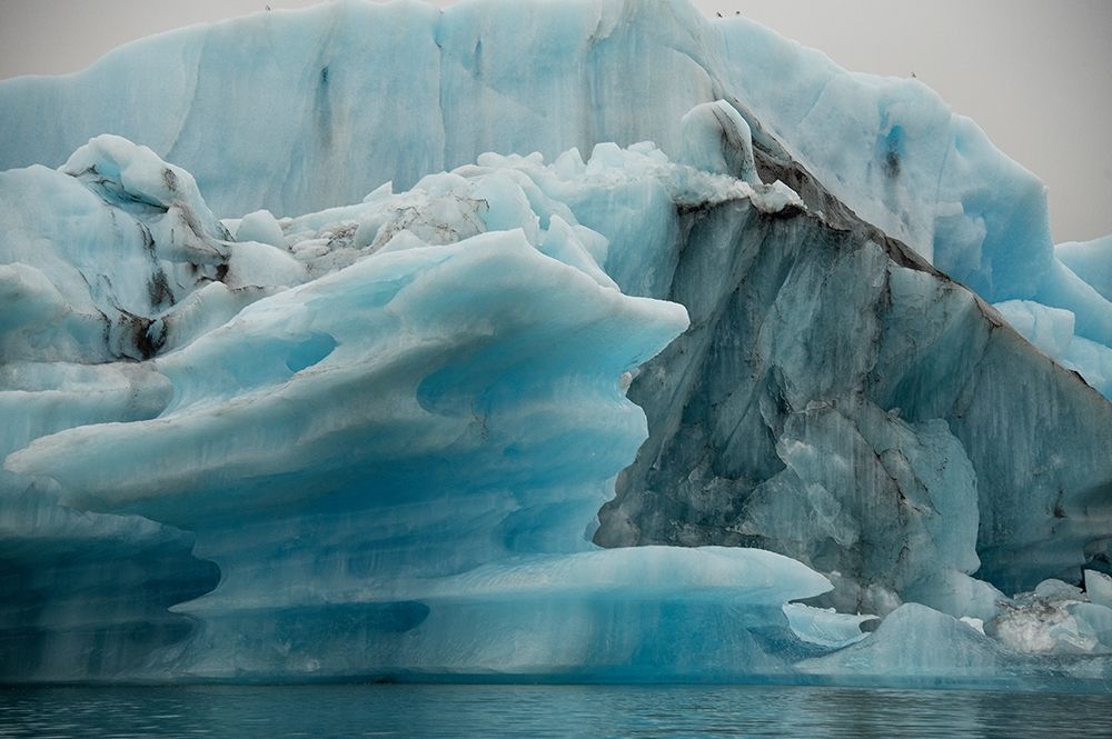 Icebergs from the Jokulsarlon glacier drift in Jokulsarlon lagoon in Iceland art print by Steve Mohlenkamp for $57.95 CAD